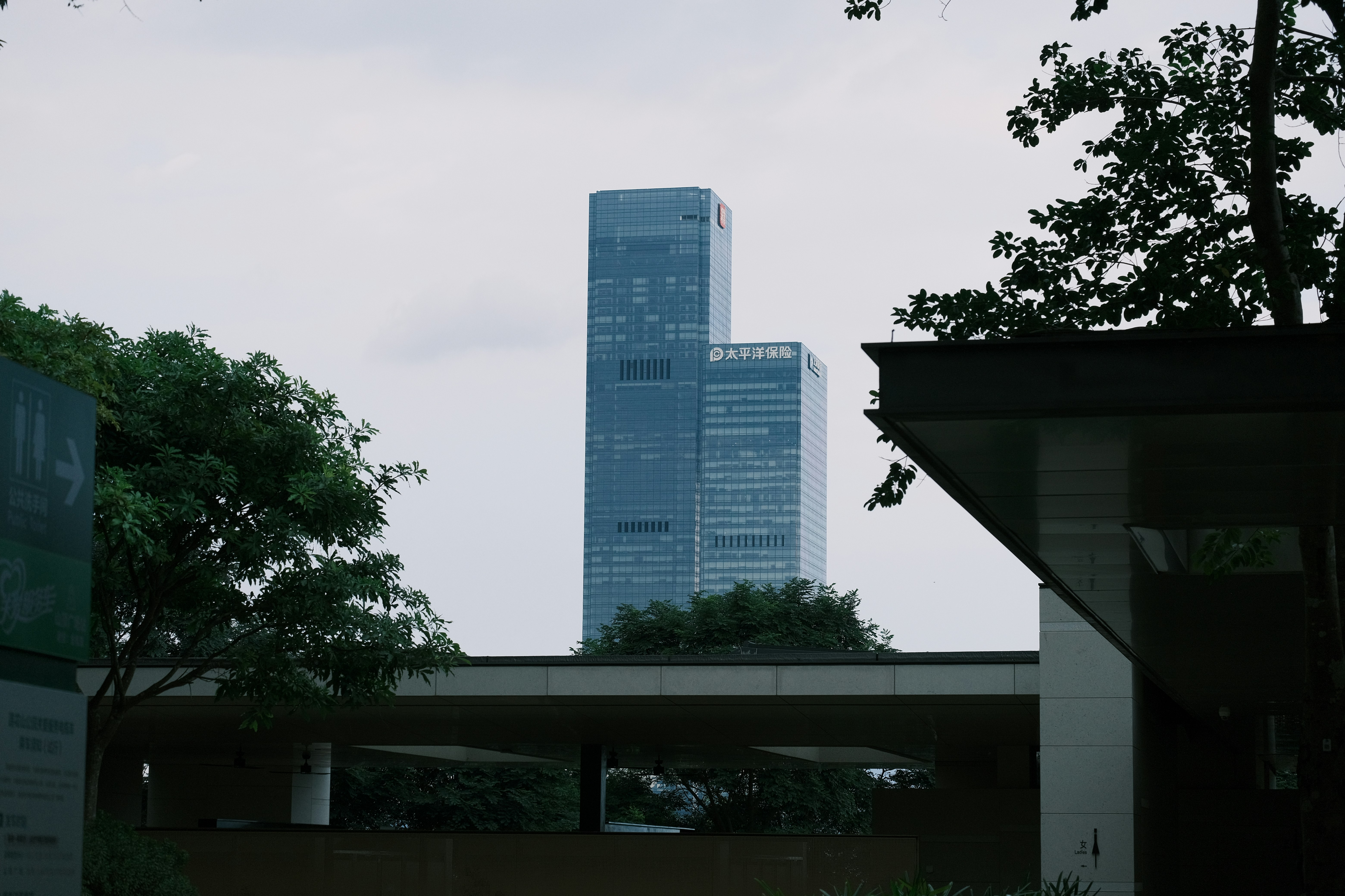 a very tall building towering over a city