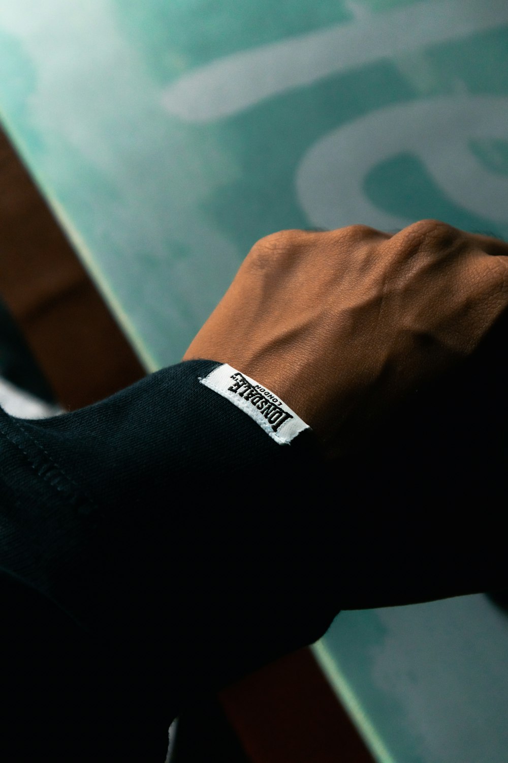 a close up of a person's hand holding a tennis racquet