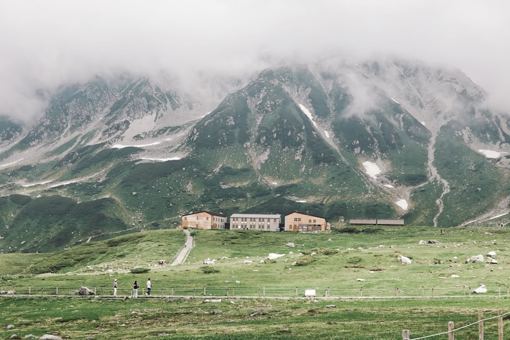 a large mountain with a house on top of it