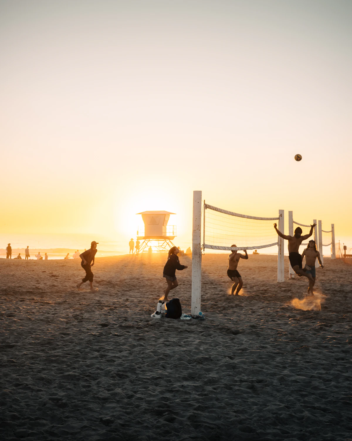 A group playing volleyball together
