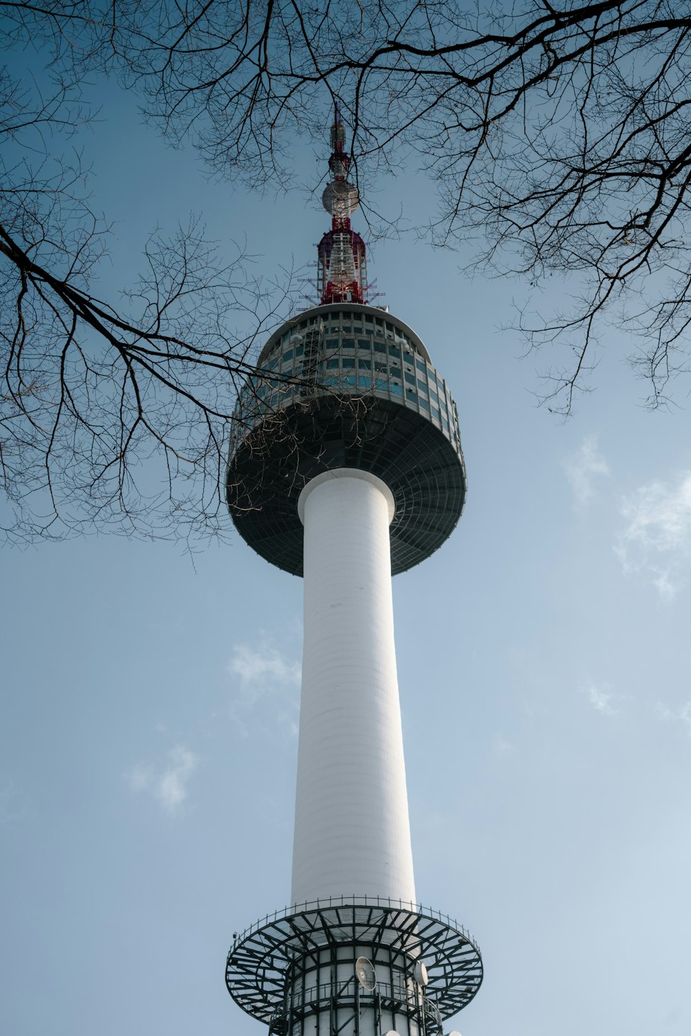 a tall white tower with a clock on top