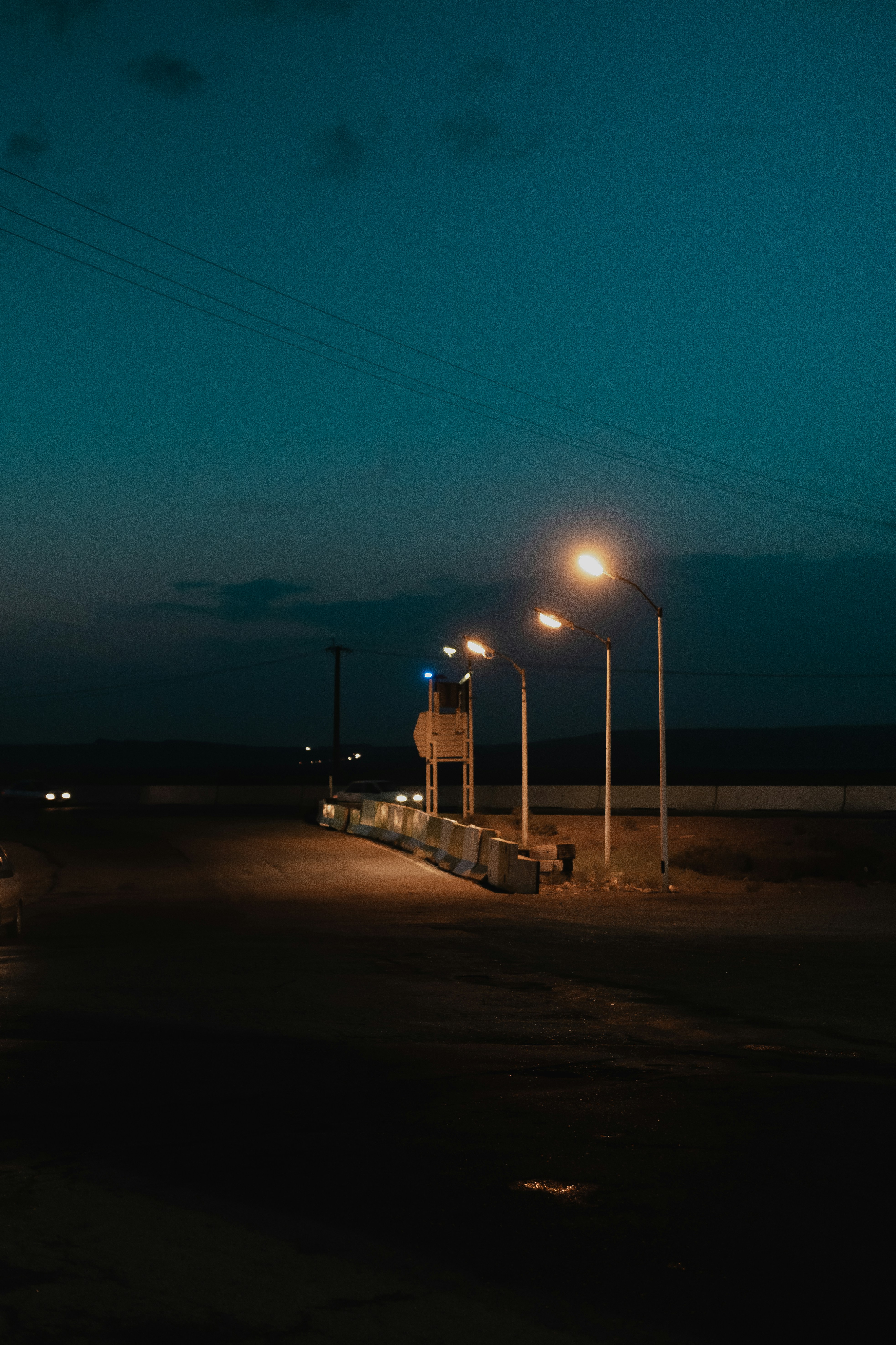 an empty street at night with street lights