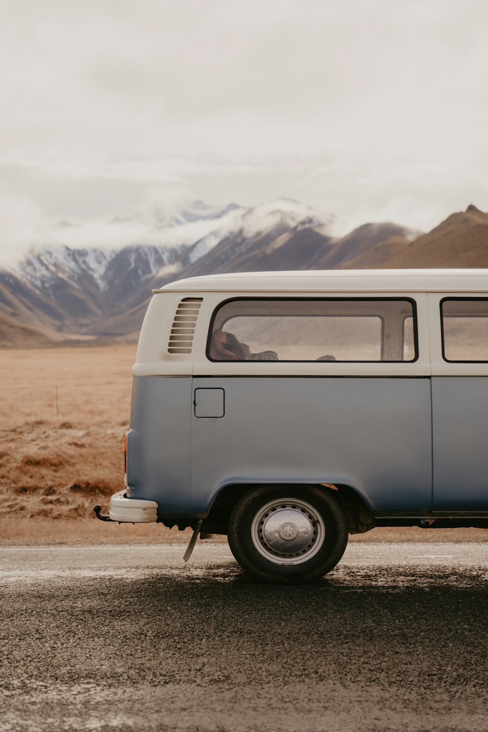 a van is parked on the side of the road