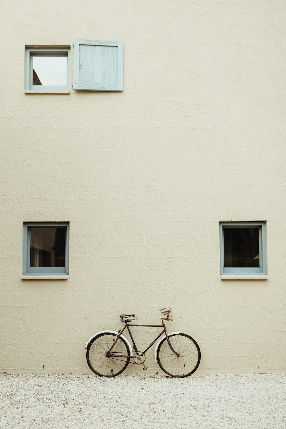 a bicycle is parked in front of a building