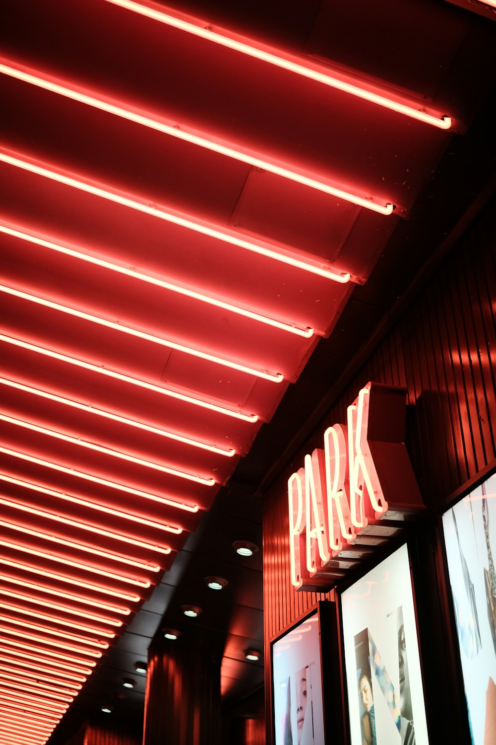 a red neon sign that reads park
