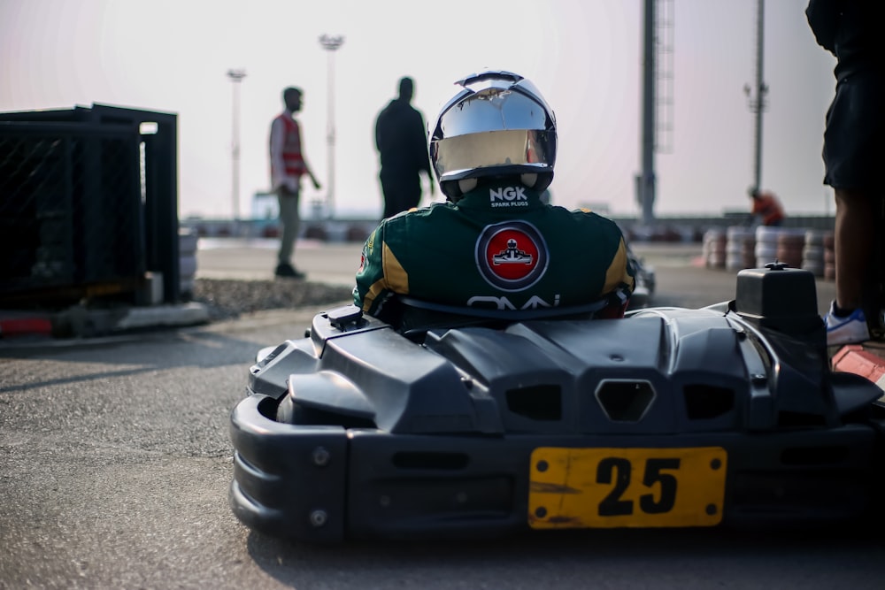 a person in a racing car on a race track