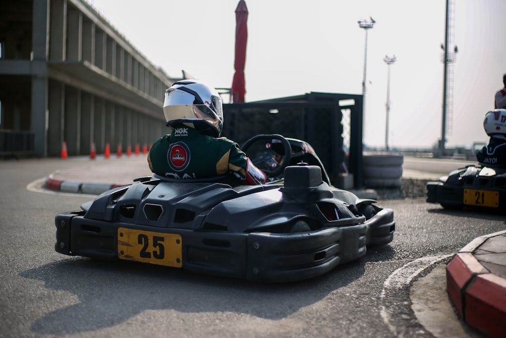 a person riding a go kart on a race track