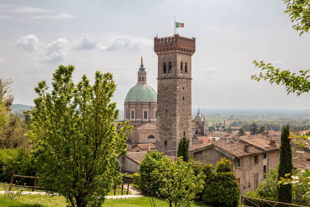 a tall tower with a flag on top of it