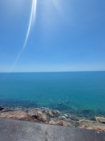 A serene view of turquoise waters along the coast of Cancún with gentle waves.