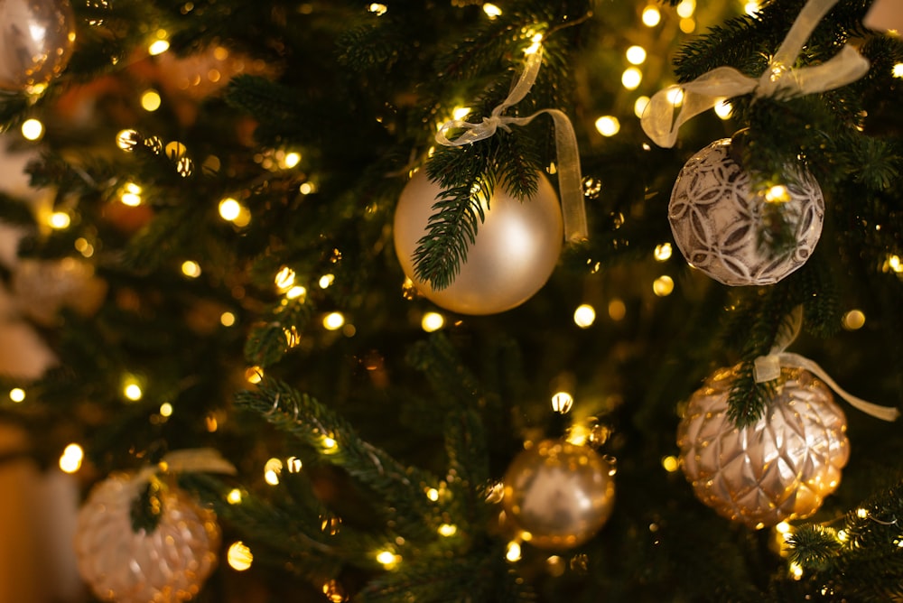 a close up of a christmas tree with ornaments