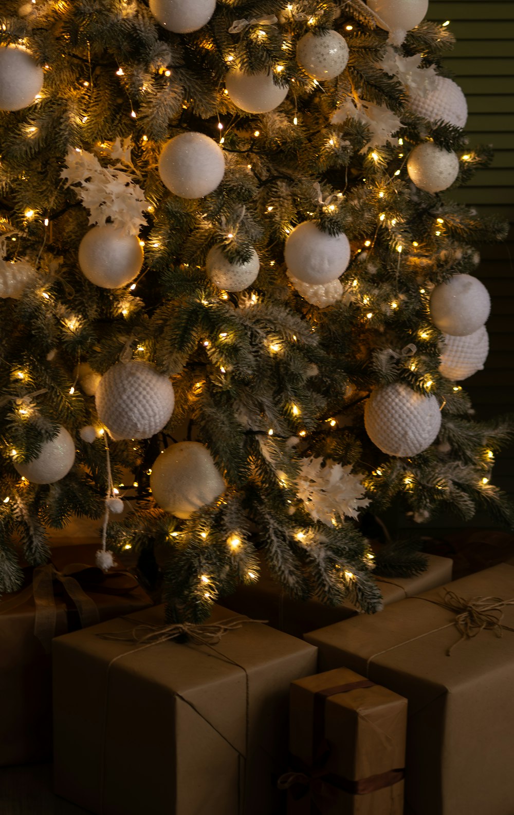 a decorated christmas tree with presents under it