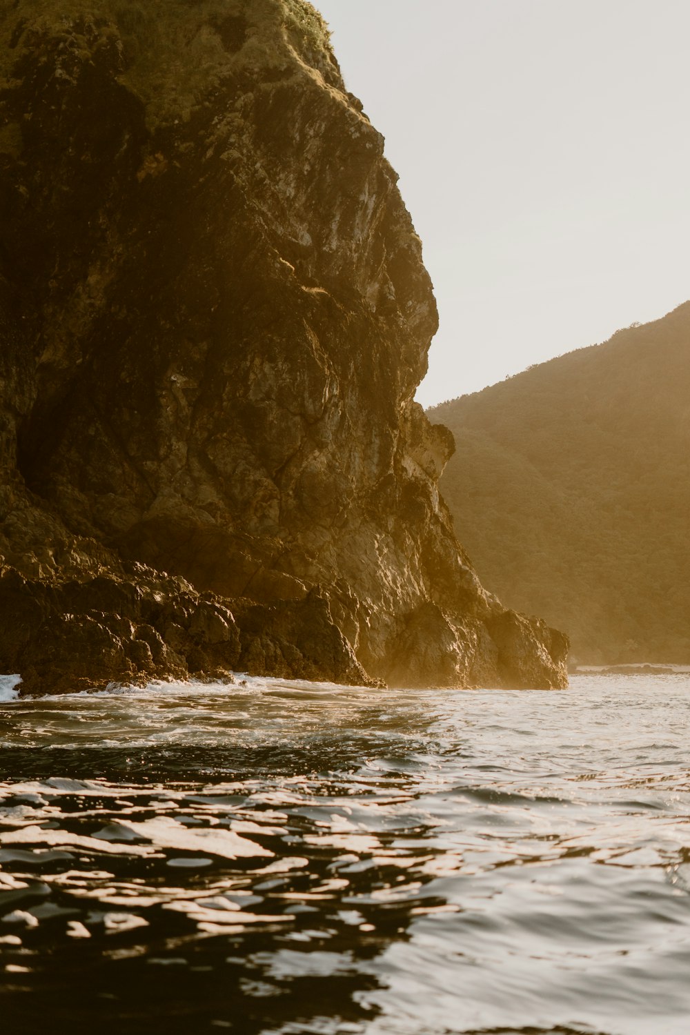 a person riding a surfboard on a body of water