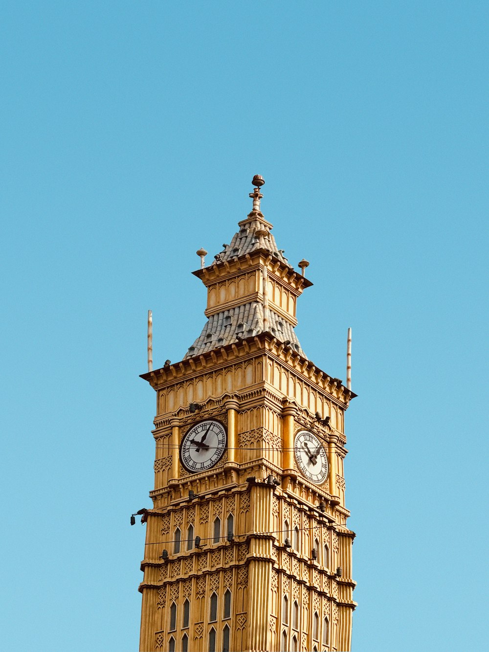 a tall tower with a clock on the top of it