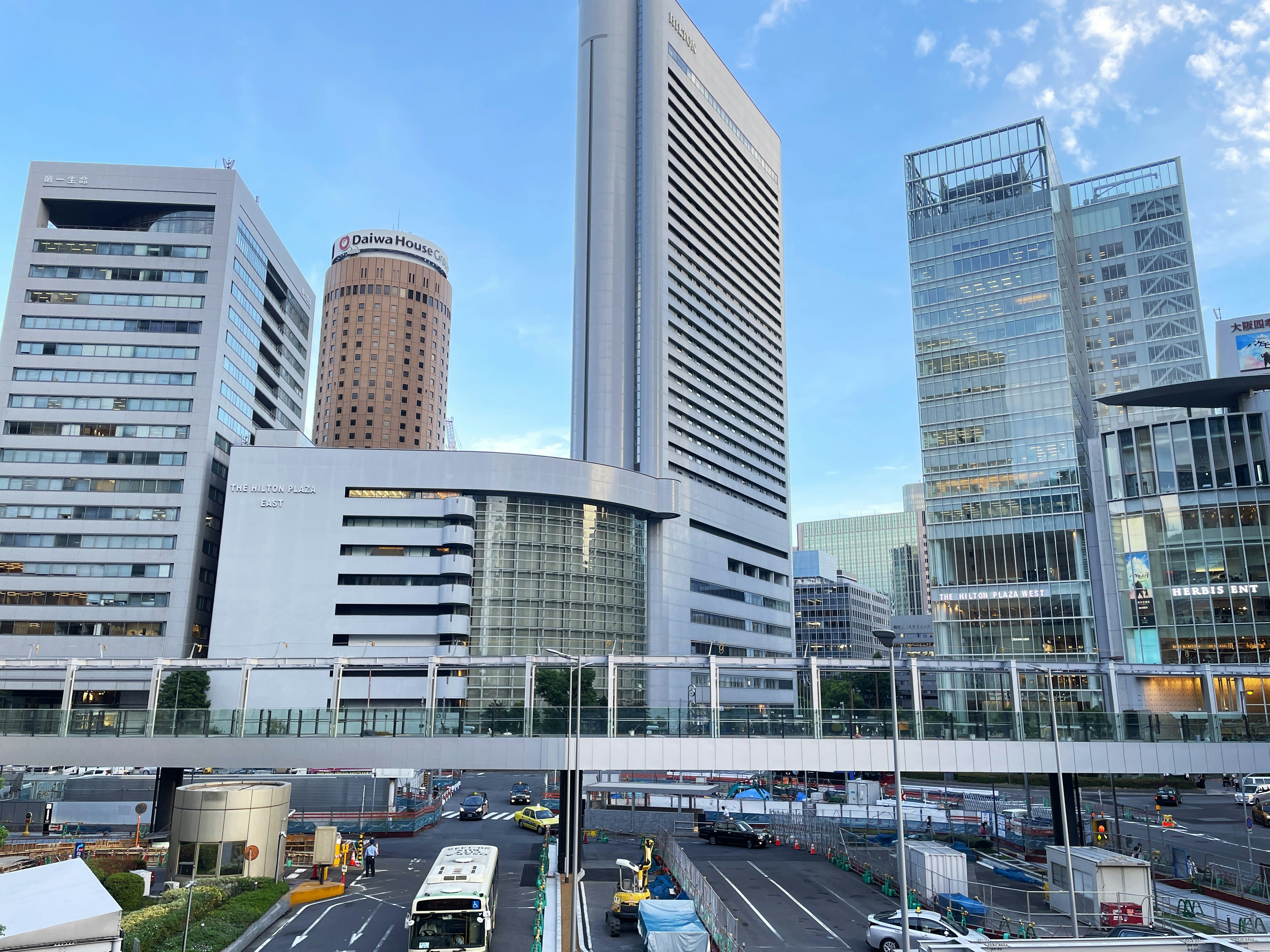 a view of a city with tall buildings in the background, Osaka, Japan