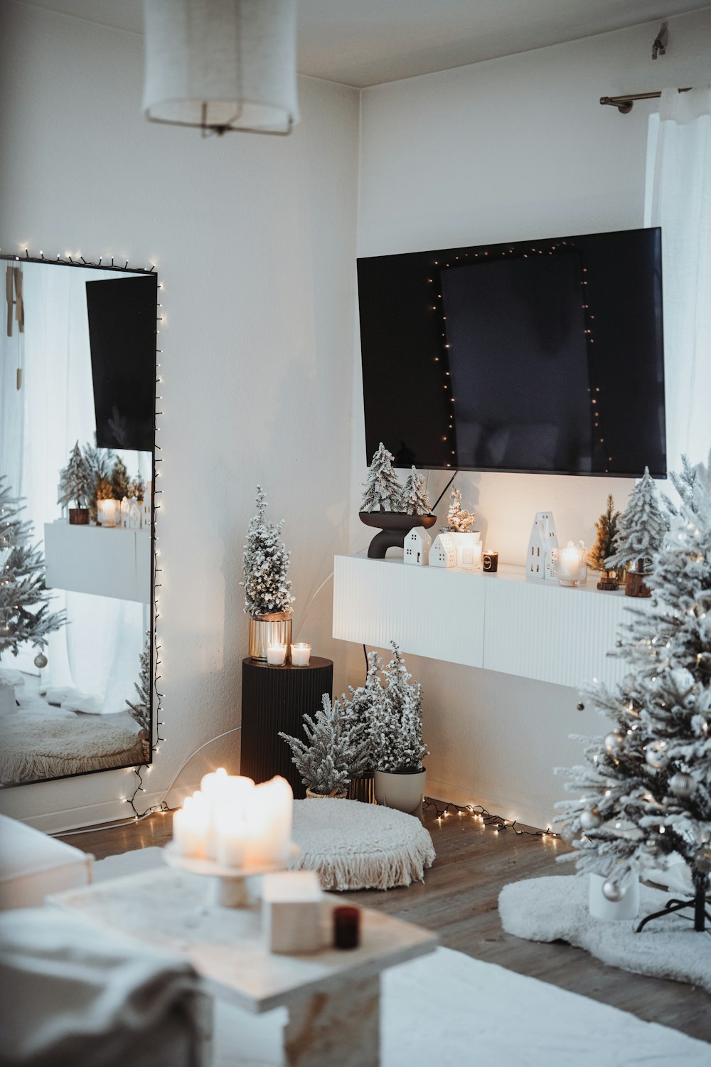 a living room decorated for christmas with candles