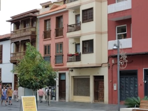 A peaceful street in Madrid showcasing affordable housing options connected through ACEI's trusted network.