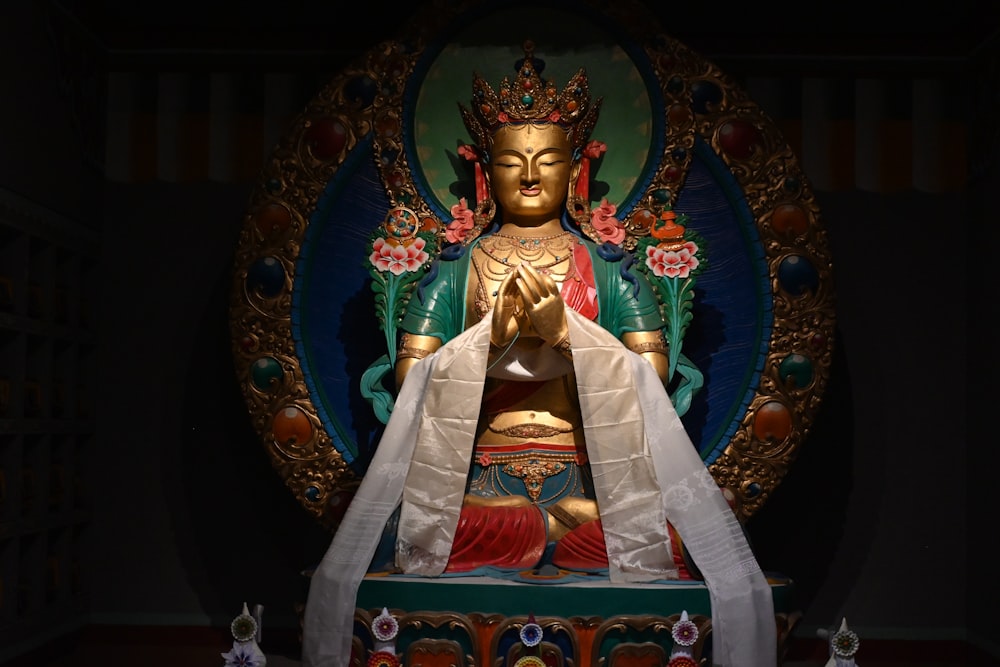 a statue of a buddha sitting in a room