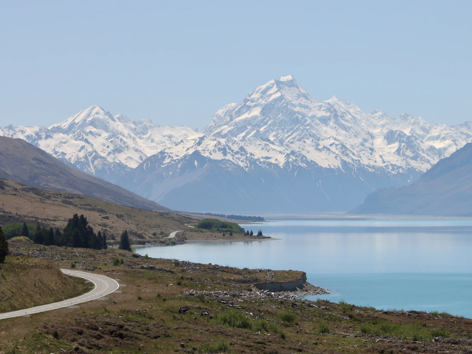 A mountain range rising above a lake in New Zealand