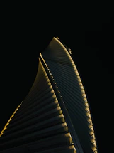 A sleek, modern skyscraper silhouette against a twilight sky, symbolizing strength and opportunity.