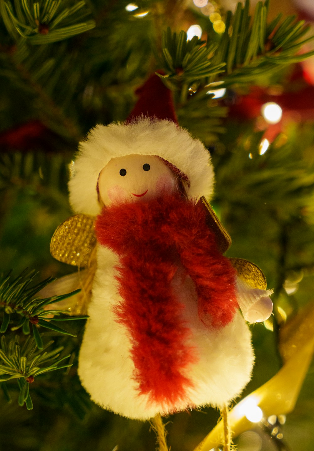 a christmas ornament hanging from a christmas tree