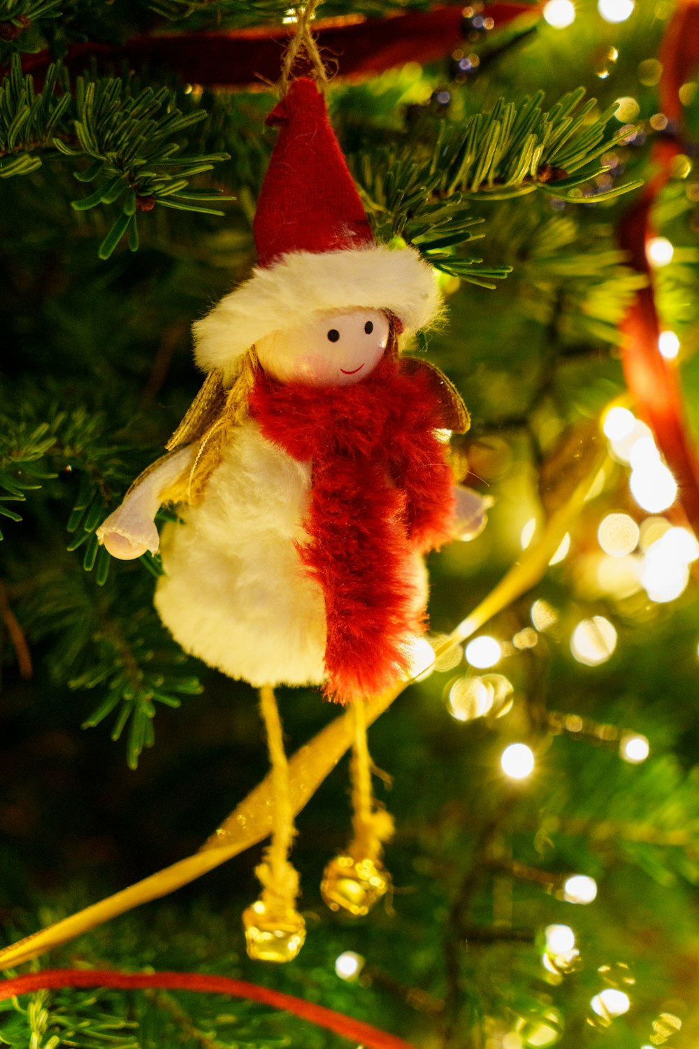 a christmas ornament hanging from a christmas tree