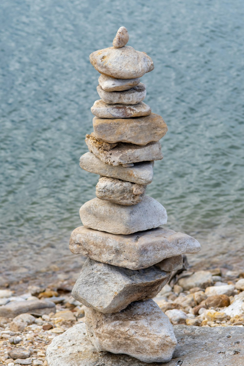 a stack of rocks sitting on top of a beach