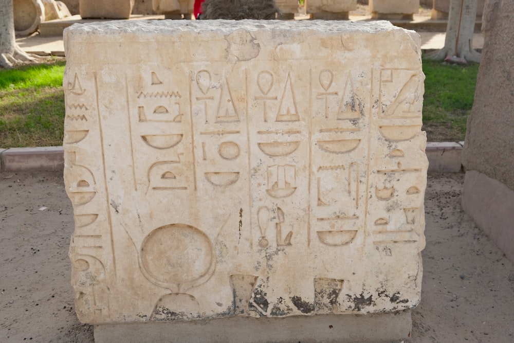 a close up of a stone with writing on it