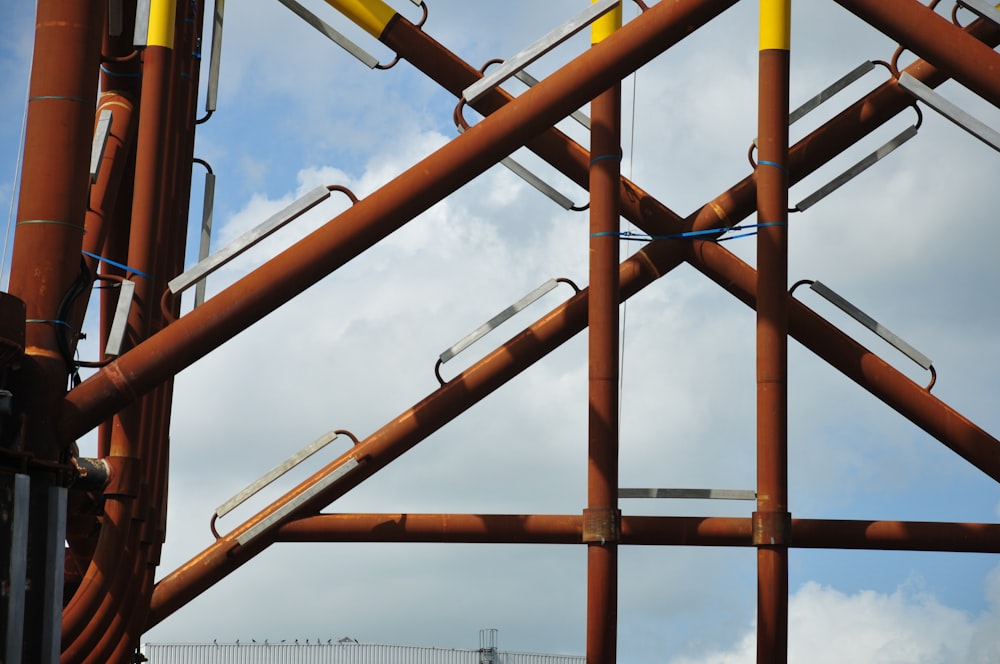 a large metal structure with a sky in the background