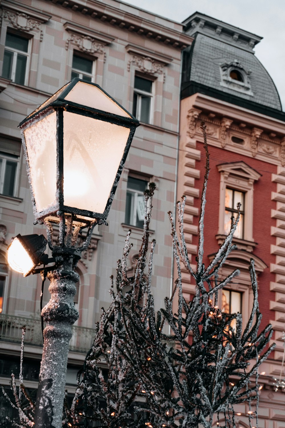 a street light with a building in the background