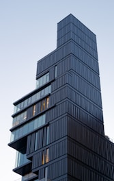 Architectural render of a modern high-rise inspired by iconic global towers.