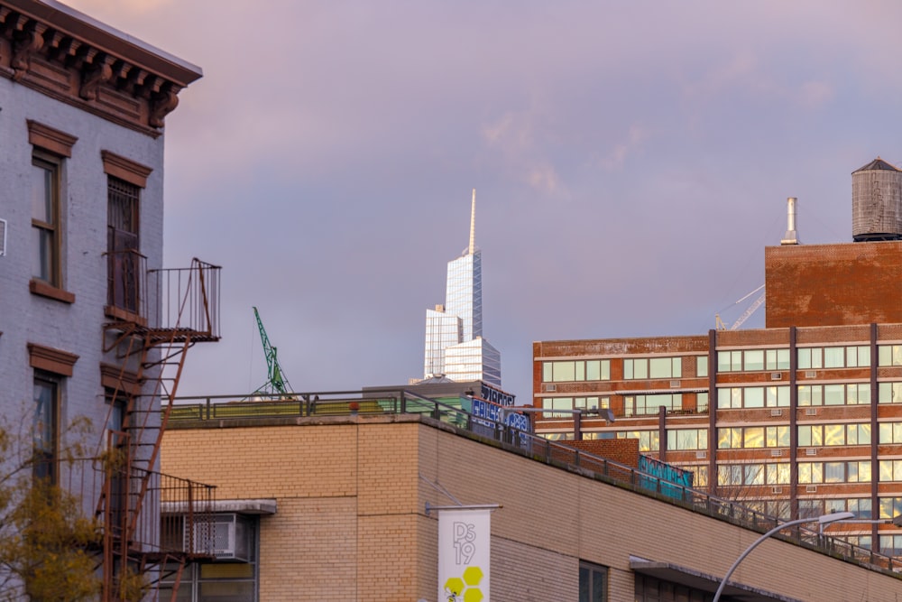 a tall building with a sky scraper in the background