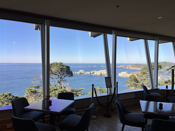 Outdoor terrace with comfortable seating and panoramic views of the coast.