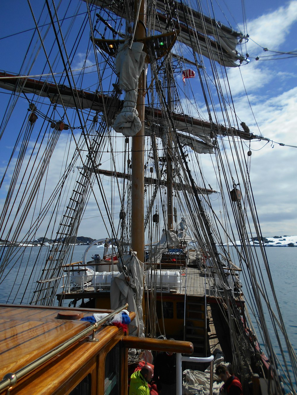 a large boat with lots of masts on the water