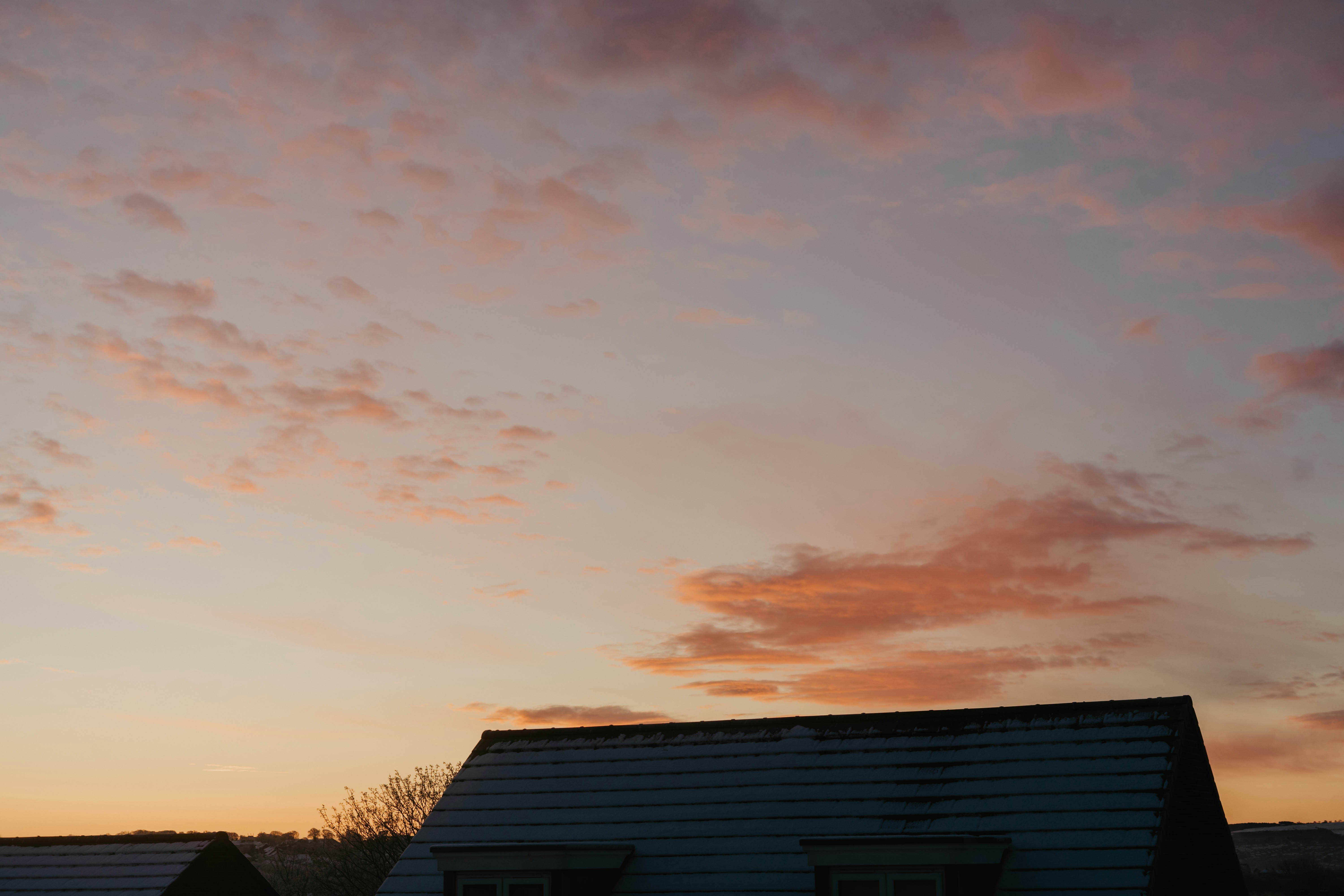 a house with a red sky in the background