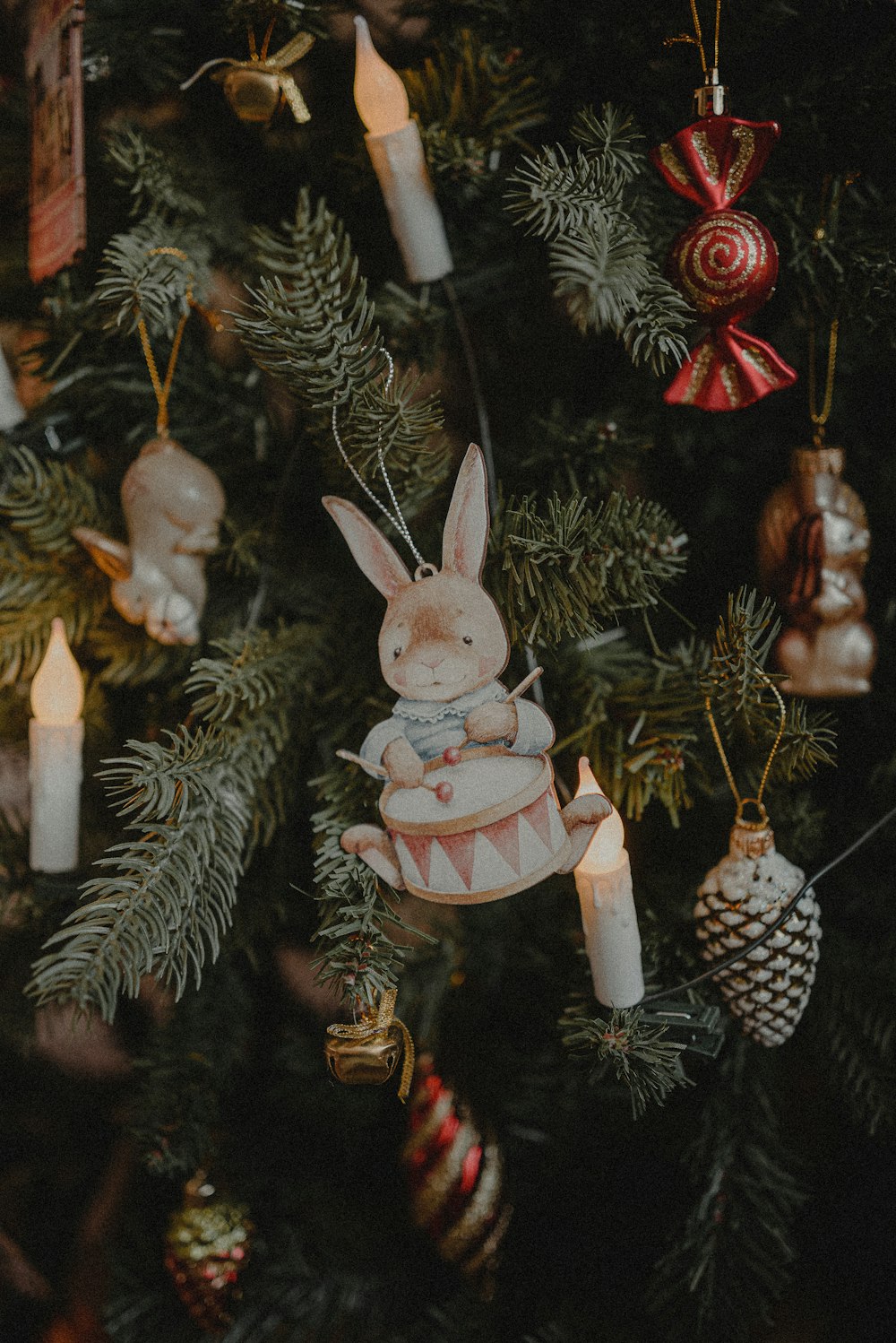 a close up of a christmas tree with ornaments