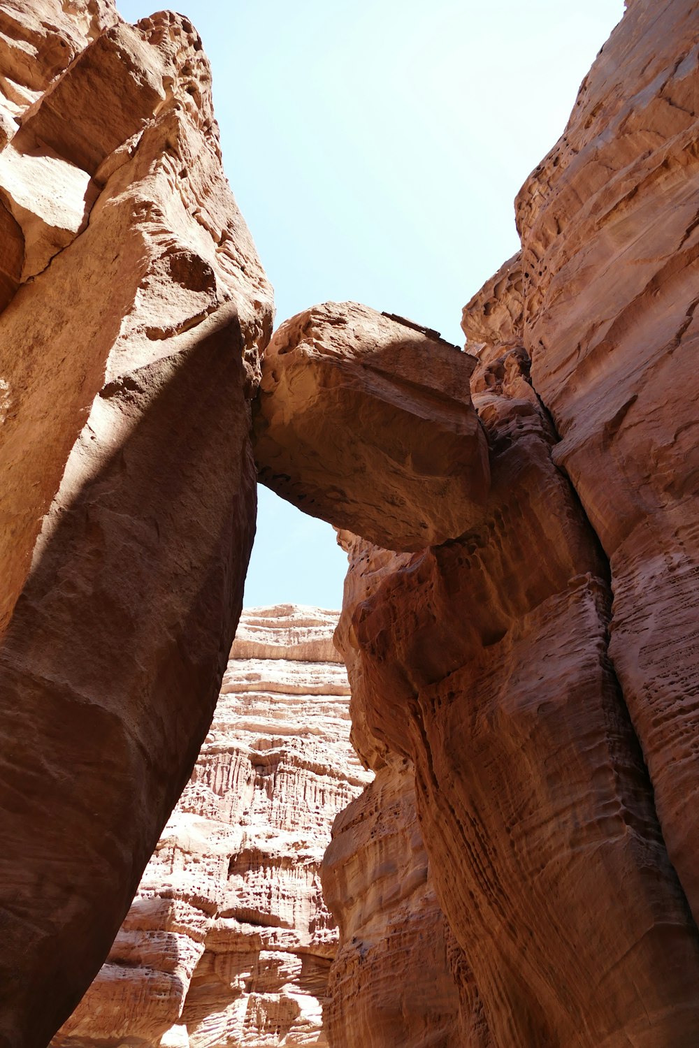 a large rock formation in the middle of a desert