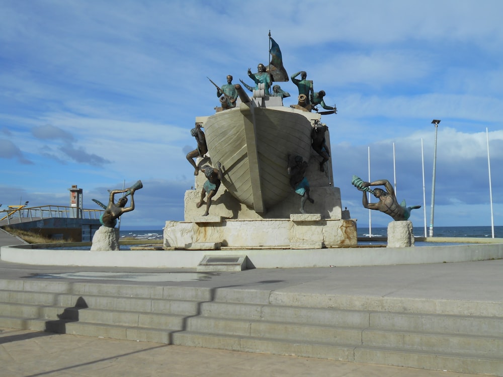 a statue of a group of people on a boat