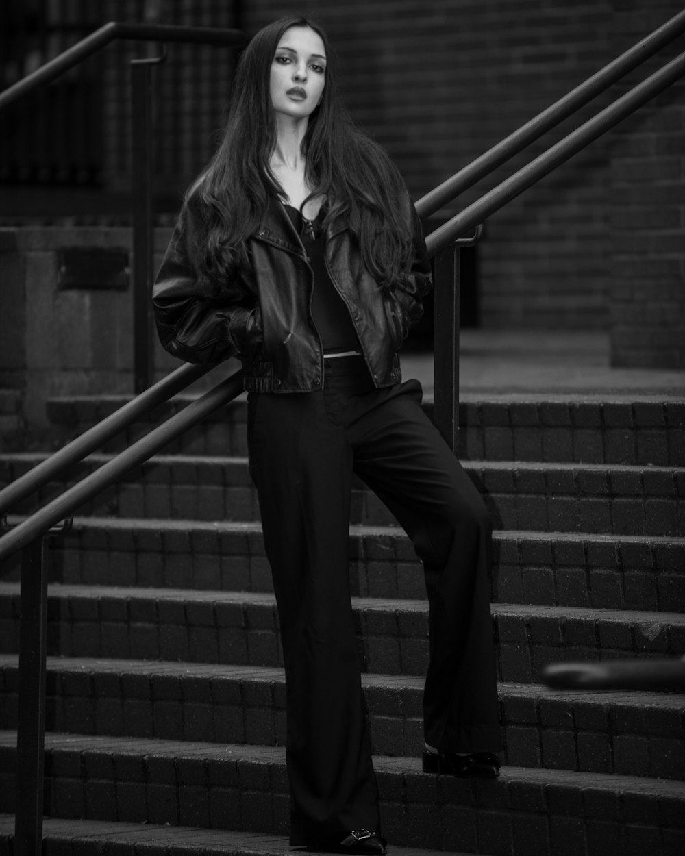 a woman standing on a set of stairs