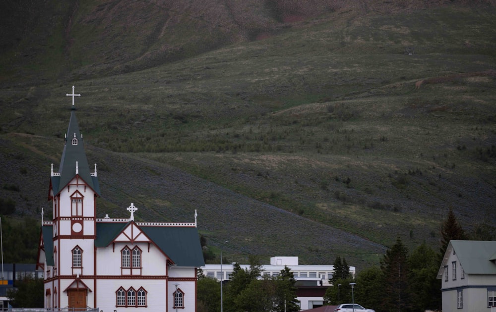 a church with a steeple and a cross on top