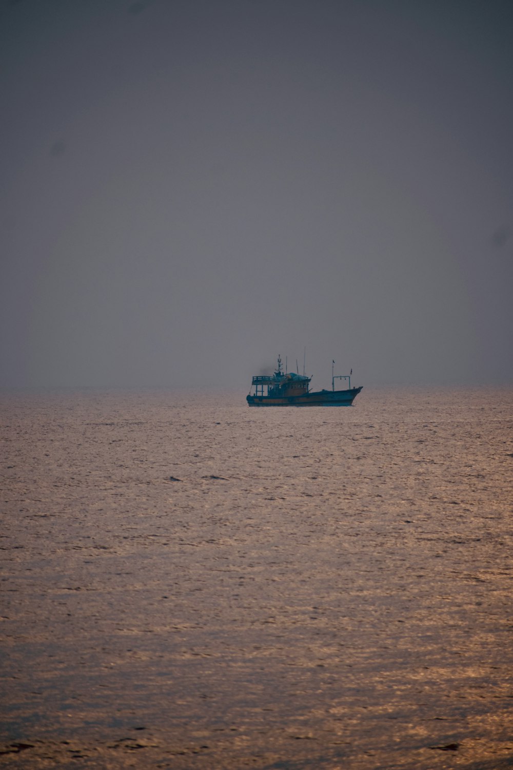 a large boat floating on top of a large body of water