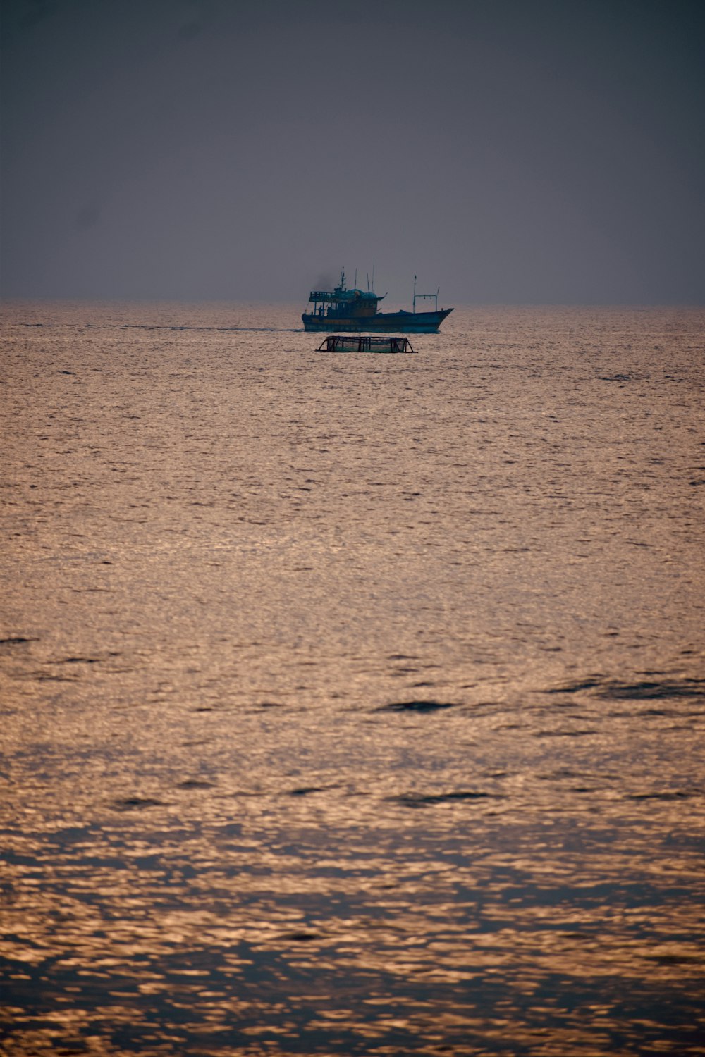 a large boat floating on top of a large body of water