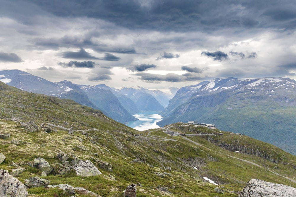 a view of a valley with mountains in the background