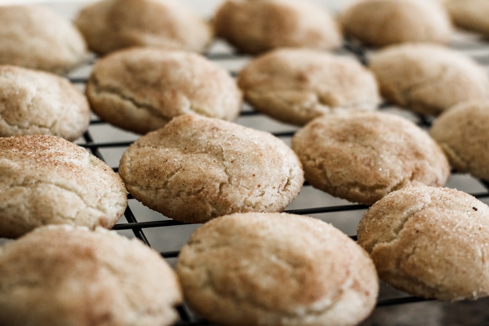 a bunch of cookies that are cooling on a rack