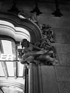 Close-up of a detailed 3D letter sign mounted on a storefront.