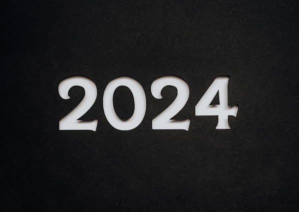 White numbers forming the year 2024 stand prominently against a dark, textured background.