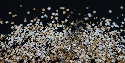 A close-up of sparkling confetti ready for a celebration.