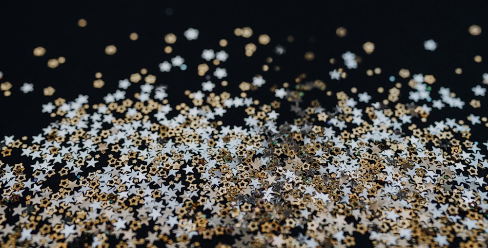 a black background with gold and white stars