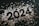 The image features black numerals forming the year 2024 surrounded by scattered star-shaped confetti. The confetti varies in color, including shades of silver and gold, creating a celebratory atmosphere.