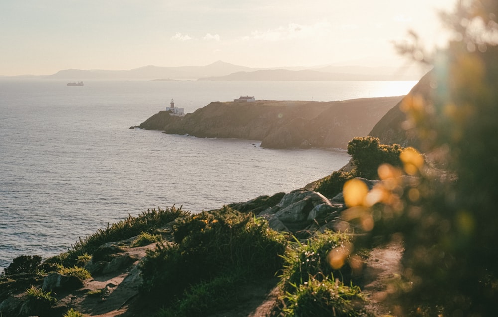 a view of a body of water with a lighthouse in the distance