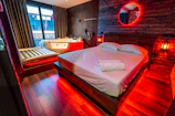 An intimate spa area with soft lighting and textured walls, perfect for evening relaxation.